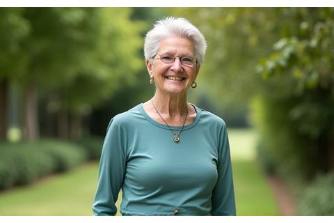 Eleanor, a vibrant 72-year-old, smiling after a brisk walk.